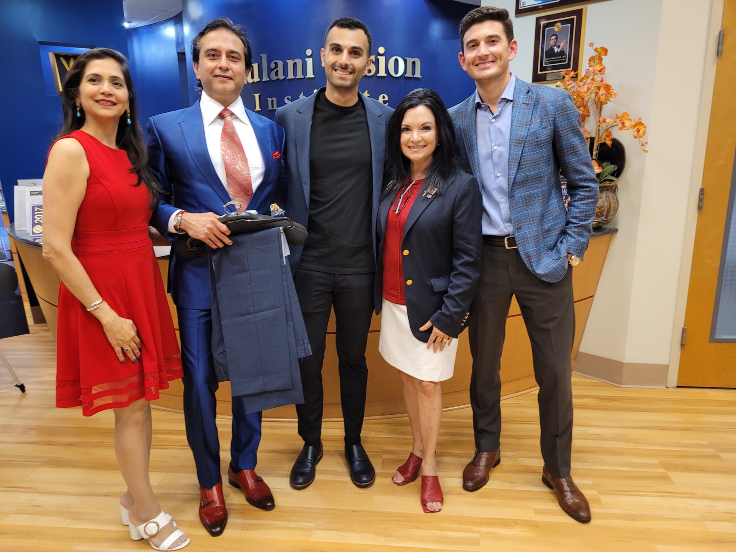 The Cultural Center at Ponte Vedra Beach in partnership with the Gulani Vision Institute donated suits to local U.S. veteran organizations, individuals and artists reentering the workforce. Attorney Chris Wynne purchased special suit for Lee Giat. Pictured from left are Dr. Suparna Gulani; Dr. Arun Gulani; Giat; Donna Guzzo, Cultural Center president and executive director; and Wynne.